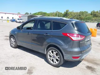 2016 Ford Escape Titanium with VIN 1FMCU0J95GUB11995, listed as a IAAI auction lot 42065255 with 142,390 mi miles. Bid and sale history available at carsss.com. Image 3.