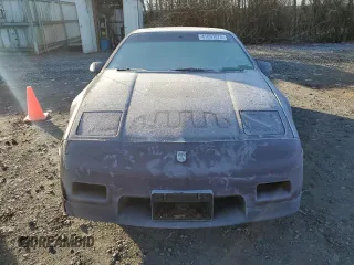 1986 Pontiac Fiero z VIN 1G2PF3793GP210763, wystawiony jako Copart lot #41891075 z przebiegiem 144 219 mil mil oraz Czysty tytuł • Clean title. Historia ofert i sprzedaży dostępna na DreamBid. Obrazek 5.