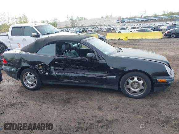 1999 Mercedes-Benz CLK with VIN WDBLK65G1XT013704, listed as a IAAI auction lot 42115880 with 85,741 mi miles. Bid and sale history available at carsss.com. Image 13.