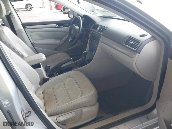 2014 Volkswagen Passat Wolfsburg Ed with VIN 1VWAS7A32EC036193, listed as a IAAI auction lot 41606595 with 77,536 mi miles. Bid and sale history available at carsss.com. Image 5.