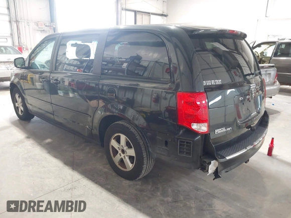 2013 Dodge Grand Caravan SXT with VIN 2C4RDGCG2DR527482, listed as a IAAI auction lot 42199622 with 198,248 mi miles and . Bid and sale history available at DreamBid. Image 3.