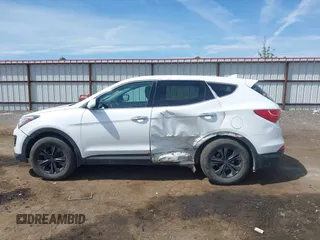 2016 Hyundai Santa Fe z VIN 5XYZTDLB9GG364375, wystawiony jako IAAI lot #42203404 z przebiegiem 143 838 mil mil oraz . Historia ofert i sprzedaży dostępna na DreamBid. Obrazek 14.