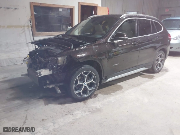 2016 BMW X1 xDrive28i with VIN WBXHT3C33GP886935, listed as a IAAI auction lot 41707367 with 73,201 mi miles. Bid and sale history available at carsss.com. Image 2.