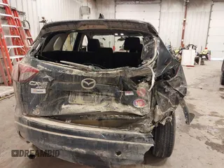 2015 Mazda CX-5 Sport with VIN JM3KE4BY0F0542655, listed as a IAAI auction lot 41471568 with 165,386 mi miles. Bid and sale history available at carsss.com. Image 6.
