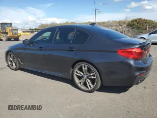 2019 BMW 5 Series M550i xDrive with VIN WBAJB9C57KB289036, listed as a Copart auction lot 86292134 with 28,103 mi miles and Salvage title. Bid and sale history available at DreamBid. Image 2.