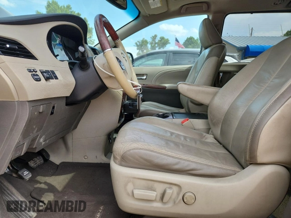 2011 Toyota Sienna XLE AAS with VIN 5TDYK3DC5BS081015, listed as a Copart auction lot 61096595 with 291,855 mi miles and Salvage title. Bid and sale history available at DreamBid. Image 7.