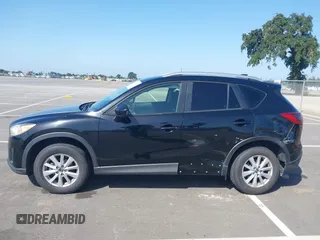 2014 Mazda CX-5 Sport z VIN JM3KE2BE8E0371775, wystawiony jako IAAI lot #42111417 z przebiegiem 150 932 mil mil oraz . Historia ofert i sprzedaży dostępna na DreamBid. Obrazek 14.