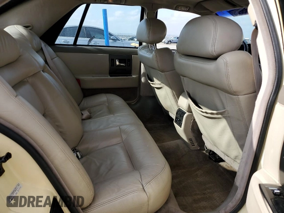1992 Cadillac Seville z VIN 1G6KS53B0NU837105, wystawiony jako Copart lot #55865205 z przebiegiem 94 740 mil mil oraz Szkody całkowita. Historia ofert i sprzedaży dostępna na DreamBid. Obrazek 10.