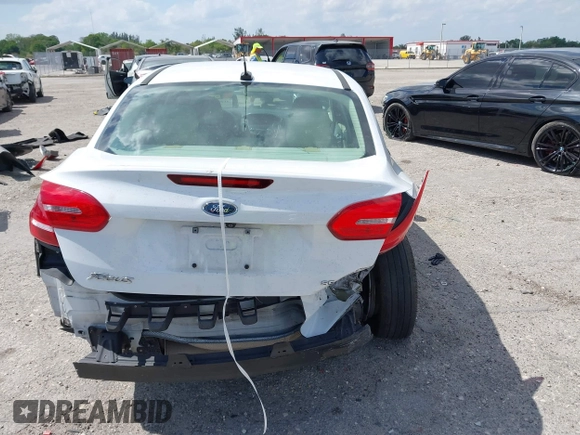 2018 Ford Focus SE with VIN 1FADP3F29JL213008, listed as a IAAI auction lot 41790224 with 85,056 mi miles and . Bid and sale history available at DreamBid. Image 6.