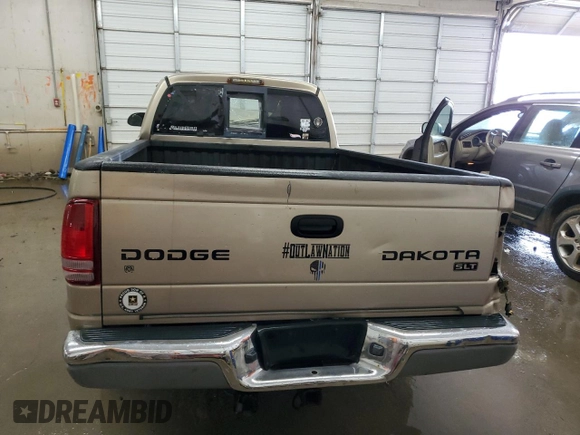 2003 Dodge Dakota SLT z VIN 1D7HL42N63S132141, wystawiony jako Copart lot #56138235 z przebiegiem 219 246 mil mil oraz Szkoda całkowita • Salvage title. Historia ofert i sprzedaży dostępna na DreamBid. Obrazek 6.