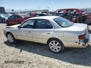 1996 Toyota Camry LE with VIN 4T1BF12K3TU132870, listed as a Copart auction lot 58052975 with 88,210 mi miles and Salvage title. Bid and sale history available at DreamBid. Image 2.