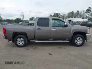 2013 Chevrolet Silverado 1500 LT with VIN 3GCPKSE74DG332907, listed as a IAAI auction lot 41951755 with 214,211 mi miles. Bid and sale history available at carsss.com. Image 13.