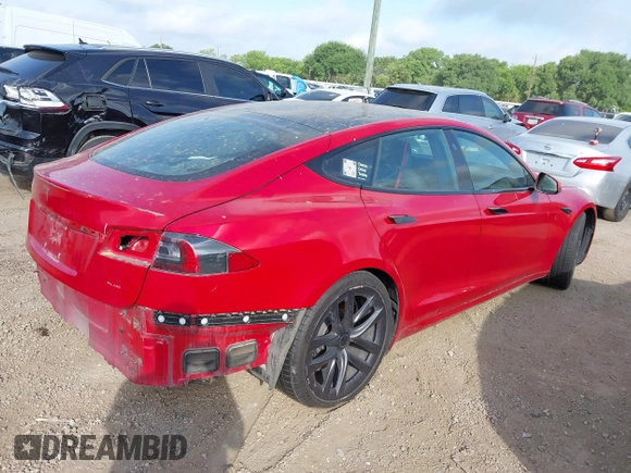 2021 Tesla Model S Plaid with VIN 5YJSA1E60MF447203, listed as a IAAI auction lot 42025120 with 58,190 mi miles. Bid and sale history available at carsss.com. Image 4.