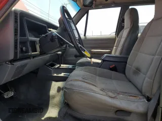 1996 Jeep Cherokee SE with VIN 1J4FT28S3TL213153, listed as a Copart auction lot 57217625 with 331,741 mi miles and Salvage title. Bid and sale history available at DreamBid. Image 7.