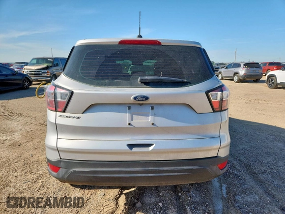 2018 Ford Escape S with VIN 1FMCU0F73JUD50086, listed as a Copart auction lot 60850495 with 67,629 mi miles and Salvage title. Bid and sale history available at DreamBid. Image 6.