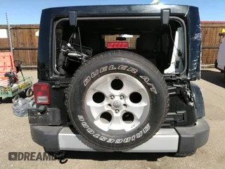 2015 Jeep Wrangler Unlimited Sahara with VIN 1C4BJWEG0FL568237, listed as a IAAI auction lot 41697726 with 82,751 mi miles. Bid and sale history available at carsss.com. Image 16.