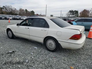 1996 Acura RL with VIN JH4KA9652TC000077, listed as a Copart auction lot 82430394 with 201,807 mi miles and Salvage Title. Bid and sale history available at carsss.com. Image 2.