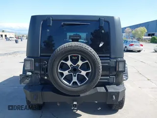 2008 Jeep Wrangler Unlimited Sahara with VIN 1J8GA59168L587554, listed as a IAAI auction lot 41963587 with 189,943 mi miles and . Bid and sale history available at DreamBid. Image 16.