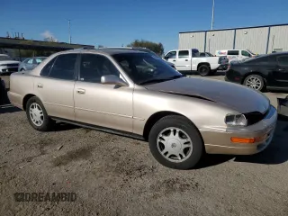 1994 Toyota Camry XLE with VIN JT2GK13E0R0017831, listed as a Copart auction lot 49887485 with 143,303 mi miles and Salvage Title. Bid and sale history available at carsss.com. Image 4.