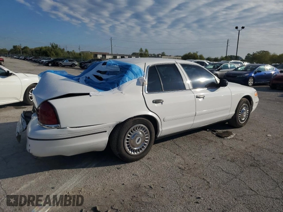1999 Ford Crown Victoria Police z VIN 2FAFP71W7XX156457, wystawiony jako Copart lot #71623954 z przebiegiem 123 313 mil mil oraz Szkody całkowita. Historia ofert i sprzedaży dostępna na DreamBid. Obrazek 3.