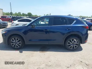 2018 Mazda CX-5 Touring z VIN JM3KFACM7J1410275, wystawiony jako IAAI lot #42248830 z przebiegiem 101 125 mil mil oraz . Historia ofert i sprzedaży dostępna na DreamBid. Obrazek 14.