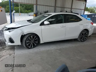 2019 Toyota Corolla L with VIN 5YFBURHE5KP860292, listed as a Copart auction lot 61806485 with 100,706 mi miles and Salvage title. Bid and sale history available at DreamBid. Image 1.