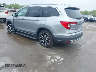 2020 Honda Pilot Touring 8-Passenger z VIN 5FNYF6H91LB042626, wystawiony jako IAAI lot #42249440 z przebiegiem 57 429 mil mil oraz . Historia ofert i sprzedaży dostępna na DreamBid. Obrazek 3.