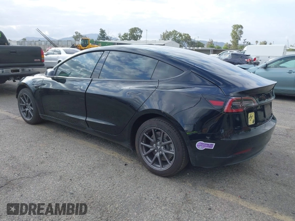 2019 Tesla Model 3 Mid Range with VIN 5YJ3E1EA3KF415601, listed as a IAAI auction lot 42125393 with 150,220 mi miles and . Bid and sale history available at carsss.com. Image 3.