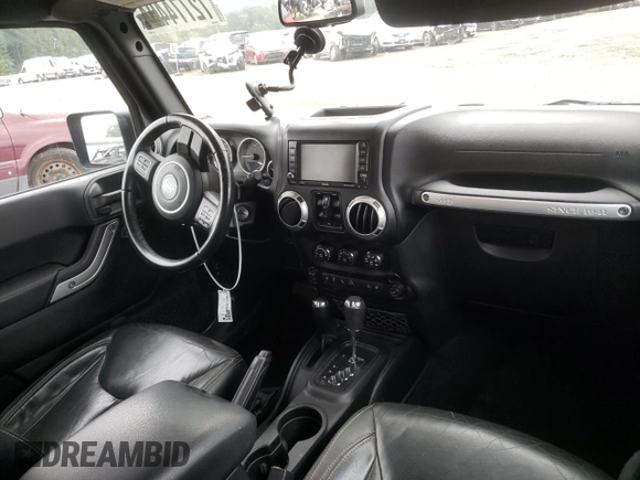 2018 Jeep Wrangler JK Unlimited Sahara with VIN 1C4HJWEG7JL909023, listed as a Copart auction lot 72774404 with 106,801 mi miles and Salvage Title. Bid and sale history available at carsss.com. Image 8.