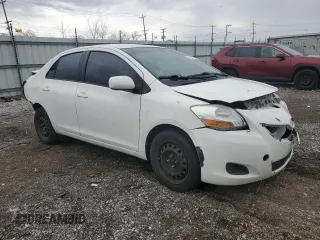 2009 Toyota Yaris with VIN JTDBT903991338082, listed as a Copart auction lot 51156955 with 328,941 mi miles and Salvage Title. Bid and sale history available at carsss.com. Image 4.