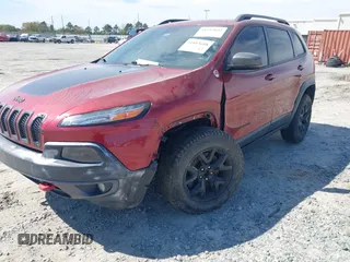 2015 Jeep Cherokee Trailhawk with VIN 1C4PJMBS1FW640483, listed as a IAAI auction lot 41883688 with 103,589 mi miles. Bid and sale history available at carsss.com. Image 6.