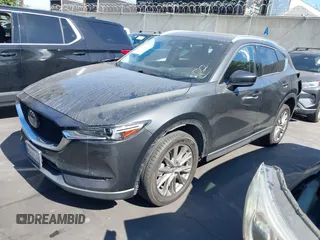 2020 Mazda CX-5 Grand Touring with VIN JM3KFADM3L1812649, listed as a IAAI auction lot 42575393 with 102,118 mi miles and . Bid and sale history available at DreamBid. Image 18.