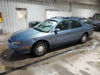 1999 Ford Taurus SE z VIN 1FAFP58S0XG301691, wystawiony jako Copart lot #81920424 z przebiegiem 203 931 mil mil oraz Szkody całkowita. Historia ofert i sprzedaży dostępna na DreamBid. Obrazek 1.