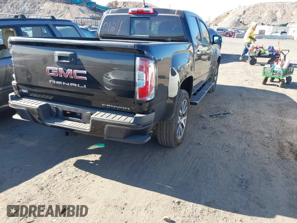 2021 GMC Canyon 4WD Denali z VIN 1GTG6EEN9M1240596, wystawiony jako IAAI lot #40760124 z przebiegiem 52 985 mil mil oraz . Historia ofert i sprzedaży dostępna na DreamBid. Obrazek 4.