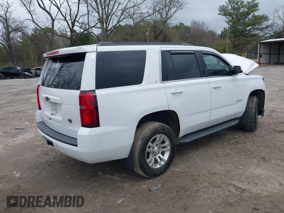 2020 Chevrolet Tahoe LT with VIN 1GNSKBKC2LR253012, listed as a IAAI auction lot 41870002 with 127,789 mi miles and . Bid and sale history available at DreamBid. Image 4.