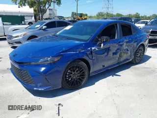 2025 Toyota Camry LE with VIN 4T1DAACK3SU104152, listed as a IAAI auction lot 42039337 with 1,423 mi miles and . Bid and sale history available at DreamBid. Image 2.