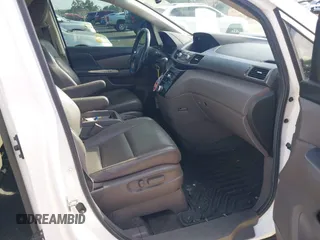 2012 Honda Odyssey EX-L z VIN 5FNRL5H61CB032353, wystawiony jako IAAI lot #42471691 z przebiegiem 186 257 mil mil oraz . Historia ofert i sprzedaży dostępna na DreamBid. Obrazek 5.