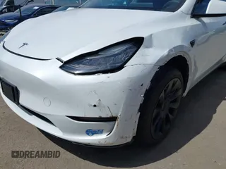 2020 Tesla Model Y Long Range with VIN 5YJYGDEE2LF058515, listed as a IAAI auction lot 41932748 with 62,885 mi miles and . Bid and sale history available at DreamBid. Image 21.
