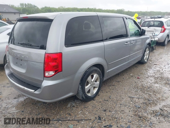 2013 Dodge Grand Caravan SE with VIN 2C4RDGBG2DR773577, listed as a IAAI auction lot 41823951 with 226,498 mi miles and . Bid and sale history available at DreamBid. Image 4.