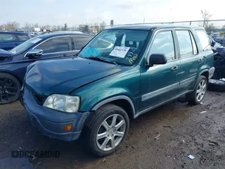 1999 Honda CR-V LX with VIN JHLRD1847XC049104, listed as a IAAI auction lot 42002338 with 213,503 mi miles. Bid and sale history available at carsss.com. Image 17.