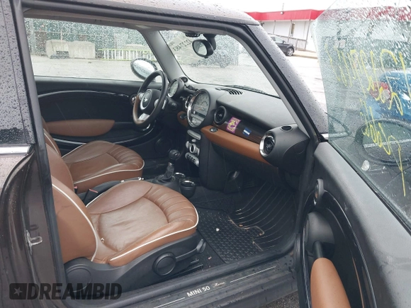2010 MINI Hardtop S with VIN WMWMF7C50ATZ74395, listed as a IAAI auction lot 42227483 with 109,704 mi miles and . Bid and sale history available at DreamBid. Image 5.