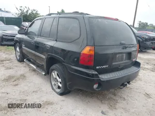 2006 GMC Envoy SLT with VIN 1GKDS13S462241866, listed as a IAAI auction lot 41943322 with 90,695 mi miles. Bid and sale history available at carsss.com. Image 3.