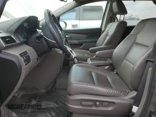 2015 Honda Odyssey Touring Elite z VIN 5FNRL5H96FB047204, wystawiony jako Copart lot #56297985 z przebiegiem 125 482 mil mil oraz Szkoda całkowita • Salvage title. Historia ofert i sprzedaży dostępna na DreamBid. Obrazek 7.