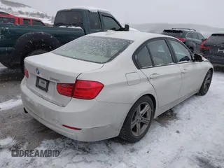 2014 BMW 3 Series 328i with VIN WBA3C1C51EK106435, listed as a IAAI auction lot 41202983 with 142,135 mi miles. Bid and sale history available at carsss.com. Image 4.