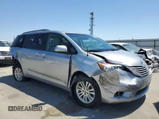 2014 Toyota Sienna XLE with VIN 5TDYK3DCXES496657, listed as a Copart auction lot 60498015 with 178,486 mi miles and Salvage title. Bid and sale history available at DreamBid. Image 4.