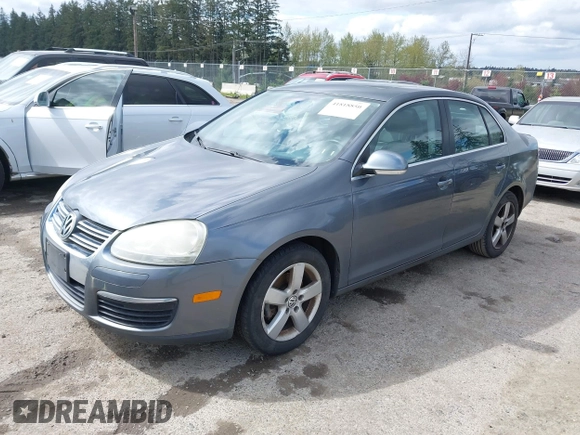 2009 Volkswagen Jetta Sedan SE with VIN 3VWRM71K59M069259, listed as a IAAI auction lot 41818850 with 164,157 mi miles. Bid and sale history available at carsss.com. Image 2.