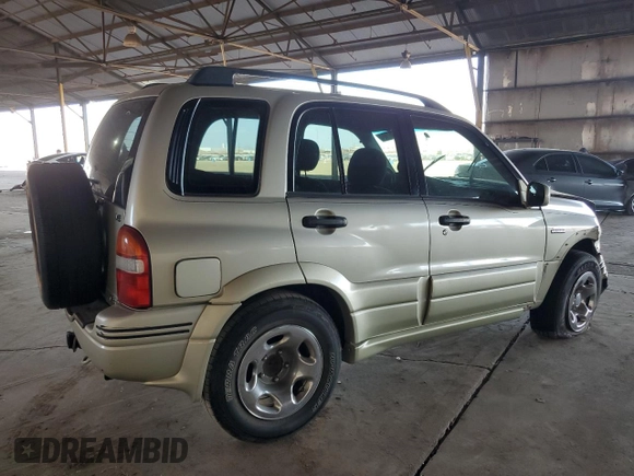 1999 Suzuki Grand Vitara JLX z VIN JS3TD62V3X4123048, wystawiony jako Copart lot #73007124 z przebiegiem 159 828 mil mil oraz Szkoda całkowita • Salvage title. Historia ofert i sprzedaży dostępna na DreamBid. Obrazek 3.