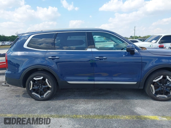 2025 Kia Telluride S with VIN 5XYP64GC0SG581646, listed as a IAAI auction lot 42063284 with 12,561 mi miles and . Bid and sale history available at DreamBid. Image 13.