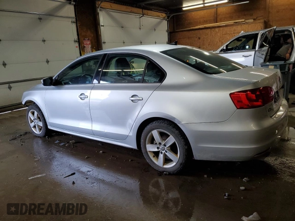 2014 Volkswagen Jetta TDI w/Premium with VIN 3VW3L7AJ3EM310892, listed as a Copart auction lot 61235765 with 242,970 mi miles and Salvage title. Bid and sale history available at DreamBid. Image 2.