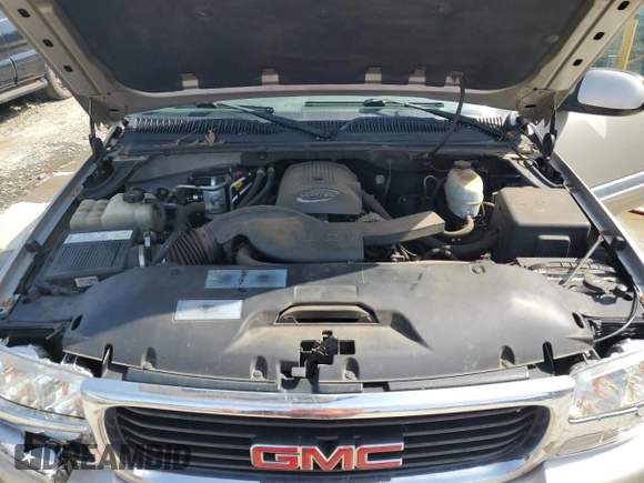 2005 GMC Yukon SLE z VIN 1GKEC13T75J179930, wystawiony jako Copart lot #57259205 z przebiegiem 310 454 mil mil oraz Szkoda całkowita • Salvage title. Historia ofert i sprzedaży dostępna na DreamBid. Obrazek 12.